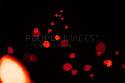 Buy stock photo Red, glitter and bokeh in a studio with dark background for celebration, event or party. Confetti, lights and color sparkles for magic, shine or glow for festive by black backdrop with mockup.
