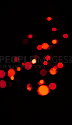 Bokeh, red and orange lights on black background with pattern, texture and mockup with cosmic aesthetic. Night lighting, sparkle particles and glow on dark wallpaper with space, color shine and flare