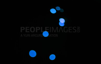 Buy stock photo Bokeh, blue dots and black background with glow or sparkle, mockup space with light, texture and flare from festival. Glitter, art and texture with graphic design, special effects on dark backdrop 
