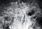 Smoke, steam or gas in a studio with dark background by mockup space for magic effect with abstract. Incense, fog or vapor mist moving in air for cloud smog pattern by black backdrop with mock up.