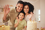 Family, birthday cake and wave portrait with mother, father and kid with present at home with smile. Gift, parents and happy boy in a kitchen with dessert, giving and event with party and celebration