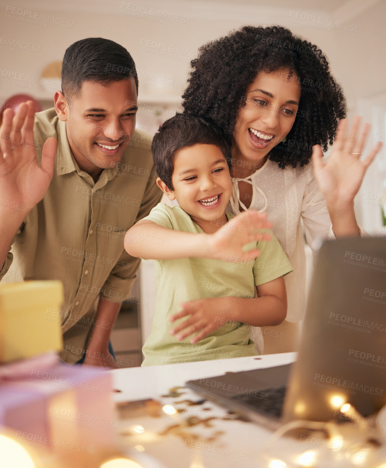Buy stock photo Happy birthday, video call and family with in a kitchen for celebration, excited and love in their home. Virtual, party and hello by parents with boy child online with cake, gift or waving gesture