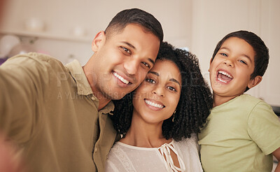 Buy stock photo Happy family, love and selfie in a living room with hug, care and fun in their home together. Portrait, bond and excited boy chid with mother, father and smile for profile picture, memory or photo