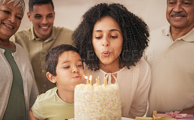 Buy stock photo Happy birthday, big family and child with cake blowing candle in a home for event to celebrate together in a house. Grandparents, happiness and kid excited for gathering, surprise and gift