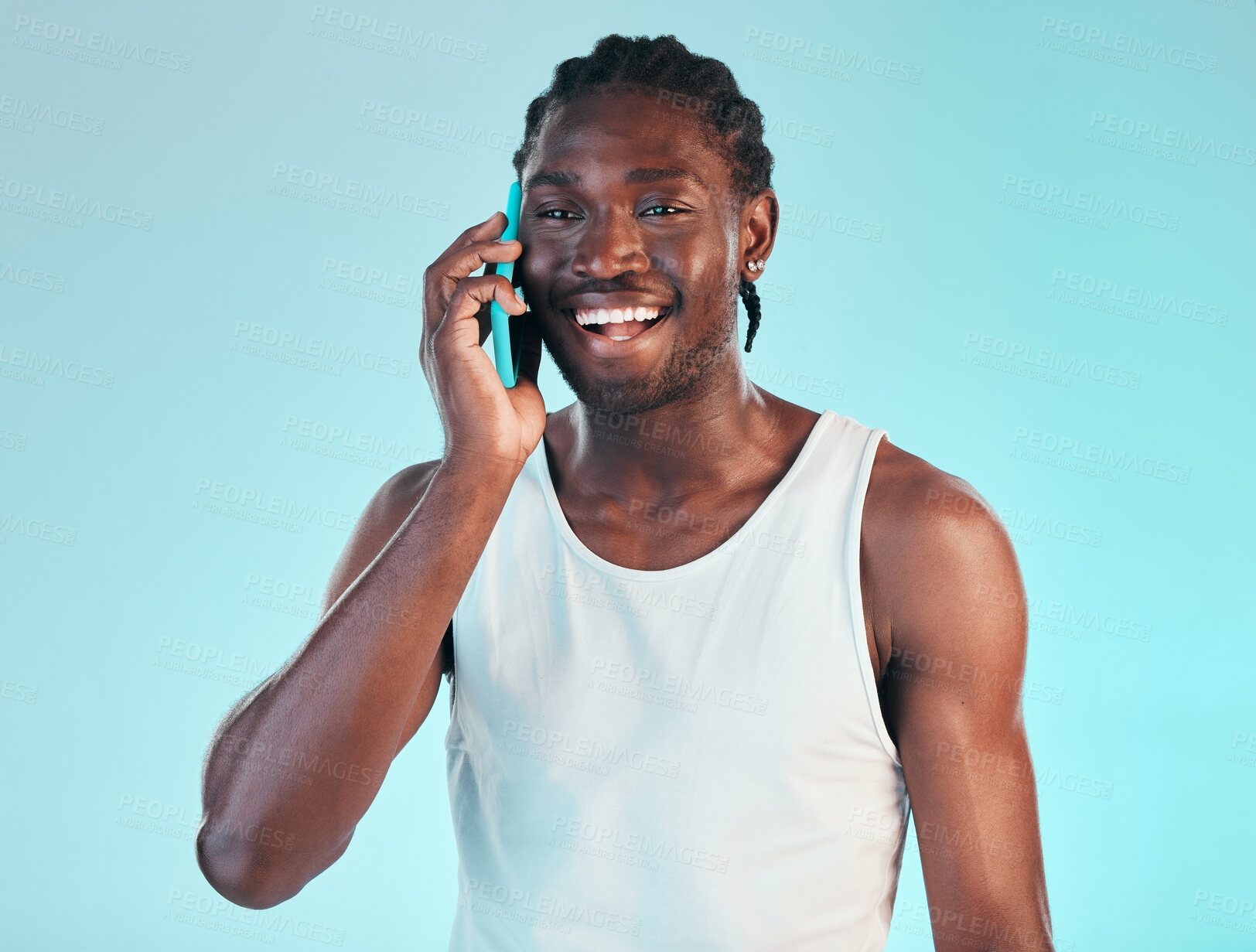 Buy stock photo Happy, phone call and man in studio with conversation, chat or networking on blue background. Smartphone, communication and face of African male model smile or contact, discussion or funny news