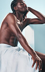 Art, body and relax black man with style, creative graphic and thinking with fitness and workout in studio. Blue background, male model and muscle with skin glow, power and strong chest with beauty