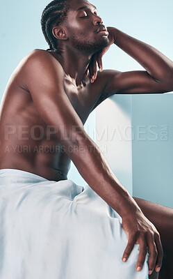 Buy stock photo Art, body and relax black man with style, creative graphic and thinking with fitness and workout in studio. Blue background, male model and muscle with skin glow, power and strong chest with beauty