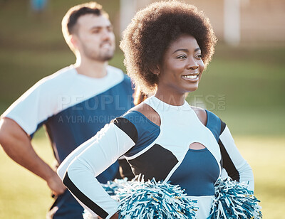 Cheerleader team, sports and black woman on field for performance, dance and motivation for game. Teamwork, dancer and happy people cheer for support in match, competition and sport event outdoors