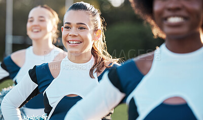 Buy stock photo Cheerleader team, sports and women on field for performance, dance and motivation for game. Teamwork, dancer and people in costume cheer for support in match, competition and sport event outdoors