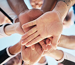 Hands, together and people in huddle for support and solidarity in community with low angle view. Palm, team building or collaboration with trust, mission in partnership or alliance with synergy