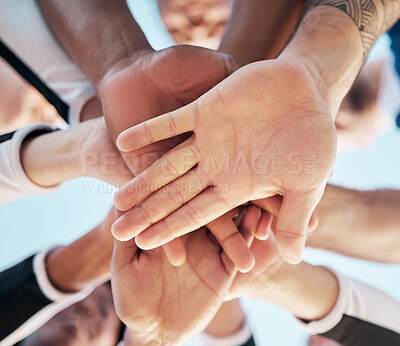 Buy stock photo Hands, together and people in huddle for support and solidarity in community with low angle view. Palm, team building or collaboration with trust, mission in partnership or alliance with synergy