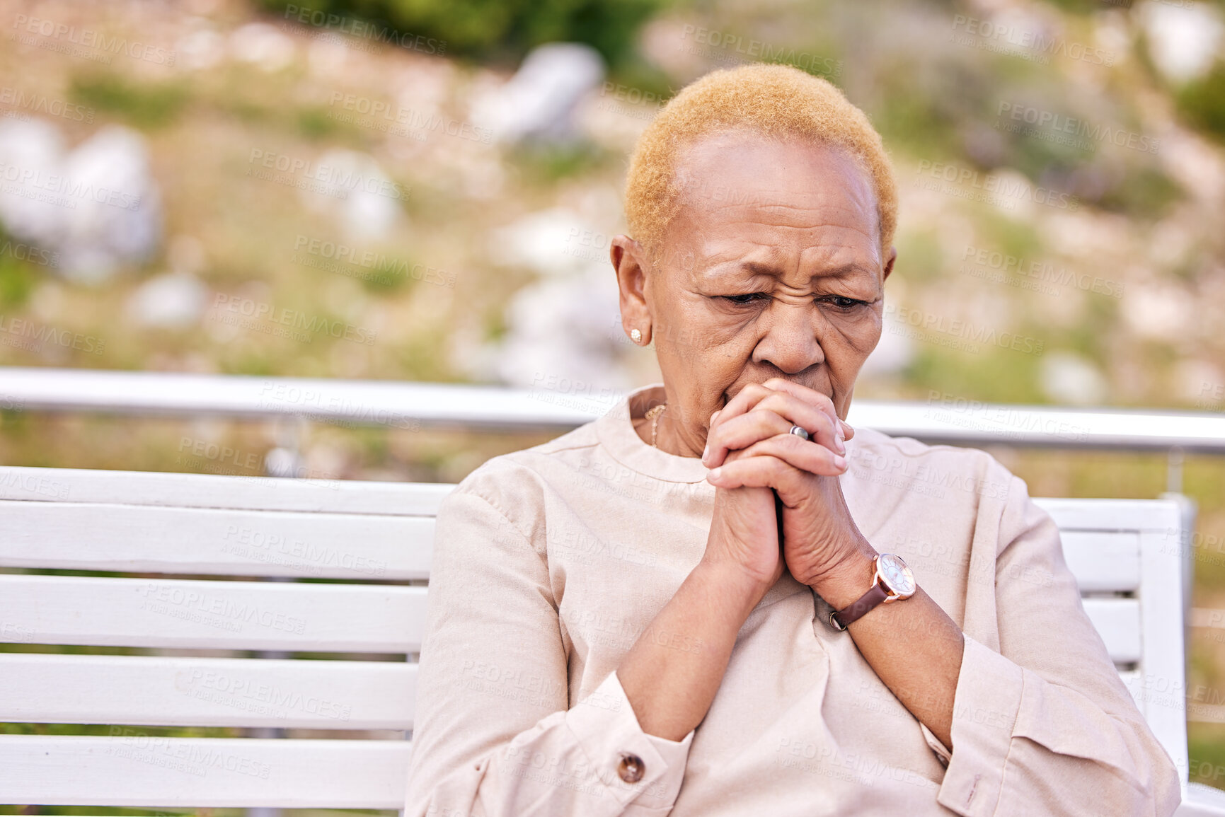 Buy stock photo Mature, woman and alone with face in worry for future, retirement or rehabilitation at nursing home. Black, elderly and person in prayer for wellness, diagnosis or treatment at hospital for health
