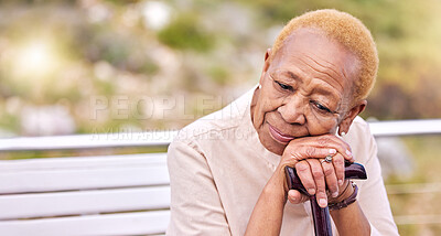 Buy stock photo Depression, walking stick and a sad senior woman on a park bench with nostalgia in nature during summer. Face, summer and an elderly person with a disability looking lonely while in the mountains