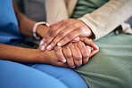 Hands, empathy and helping with life crisis, caregiver with patient for support and grief counseling. People sitting together, healthcare and wellness with advice, kindness and respect with trust