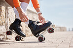 Tie, shoes and hands of woman with roller skates outdoor for exercise, workout or training with wheels on sidewalk. Fun, sport and person start fitness with rollerskating and cardio in summer