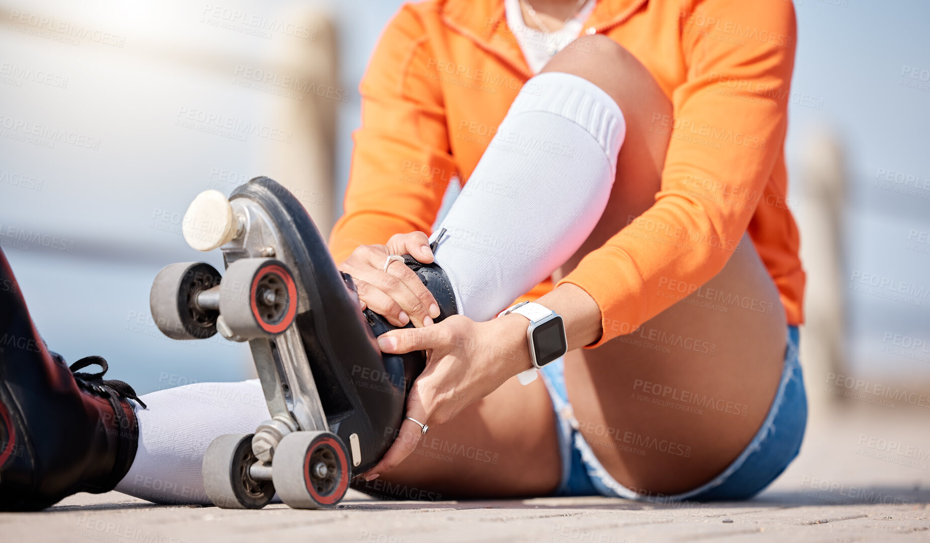 Buy stock photo Woman, hands and shoes to roller skate outdoor for exercise, workout or training with wheels on sidewalk or ground. Start, sport and person with cardio, fitness or rollerskating gear in summer