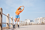 Roller skate, stretching and banner with a girl at the promenade on a blue sky background for the weekend. Fitness, beach and balance with a young person skating outdoor during summer on mockup space