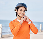 Woman, helmet and portrait on road, outdoor and ocean with smile for safety, fitness or exercise in summer. Girl, ppe and sports with pride, start and ready for workout, training and freedom by sea