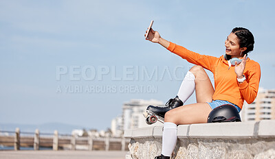 Buy stock photo Roller skating, woman and selfie with smile for profile picture, internet post and social media outdoor in nature. Sport, person and headphones by ocean or sea for relax, freedom and happiness online