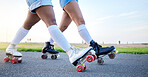 Feet, roller skates and closeup in park, street and outdoor for training, fitness or friends in summer. People, together and skating shoes on asphalt road for exercise, workout or moving for wellness