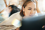 Lesbian, couple and bed with laptop for streaming movie or internet for relax, connection or diversity. Lgbt woman, weekend comfort or home together watch film, social media or subscription for happy
