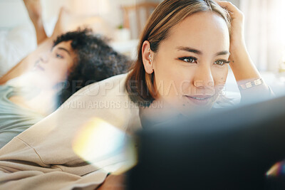 Buy stock photo Lesbian, couple and bed with laptop for streaming movie or internet for relax, connection or diversity. Lgbt woman, weekend comfort or home together watch film, social media or subscription for happy