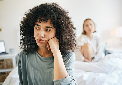Buy stock photo Lgbtq, woman and frustrated for couple fight in bedroom of home with conflict, crisis or problem in relationship. Lesbian, partner and girl on bed with stress, anxiety and depressed for argument