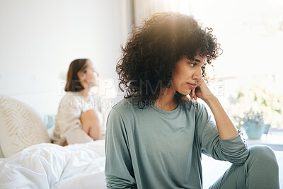 Buy stock photo Lgbtq, woman and stress for couple fight in bedroom of home with conflict, crisis or problem in relationship. Lesbian, partner and girl on bed with sad, anxiety and depressed for argument and divorce