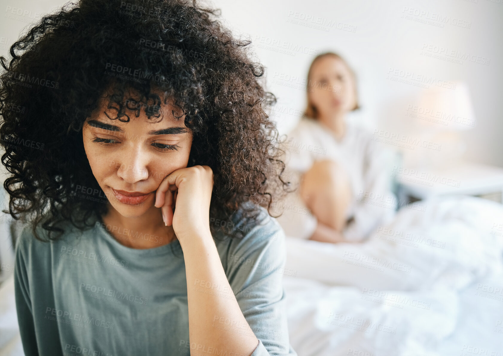 Buy stock photo Lgbtq, woman and sad for couple fight in bedroom of home with conflict, crisis or problem in relationship. Lesbian, partner and girl on bed with stress, anxiety and depressed for argument and divorce
