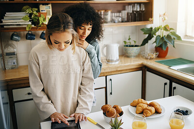 Buy stock photo Lesbian, couple and cooking breakfast in kitchen together in morning with nutrition, love and support in home. Lgbt, women or friends with food, juice and preparing healthy diet on counter in house