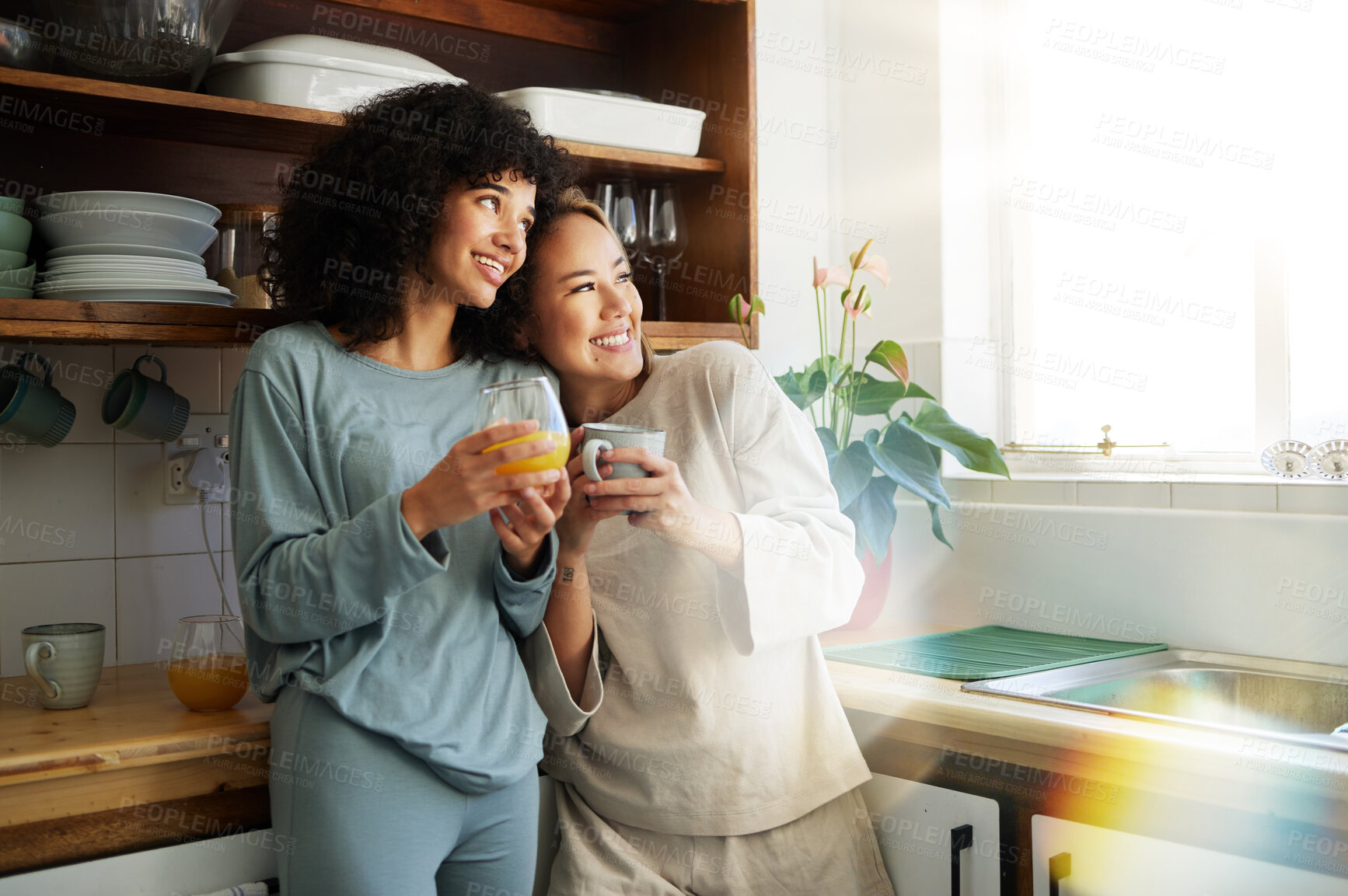 Buy stock photo Lgbt couple, coffee and kitchen with smile for connection, romantic or relationship happiness. Lesbian woman partner, apartment and freedom hug for equality conversation, together or diversity pride