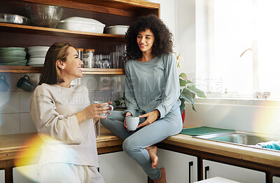 Buy stock photo Coffee, smile and lesbian couple in home kitchen, bonding and communication. Drink tea, gay women and happy girls in the morning at breakfast together in interracial relationship, care and LGBT love