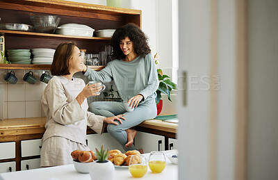 Buy stock photo Lgbtq, women and couple with love in kitchen for breakfast, nutrition and vitamin c in the morning. Food, people and happiness with coffee and pajamas or natural face for wellness, romance and care 