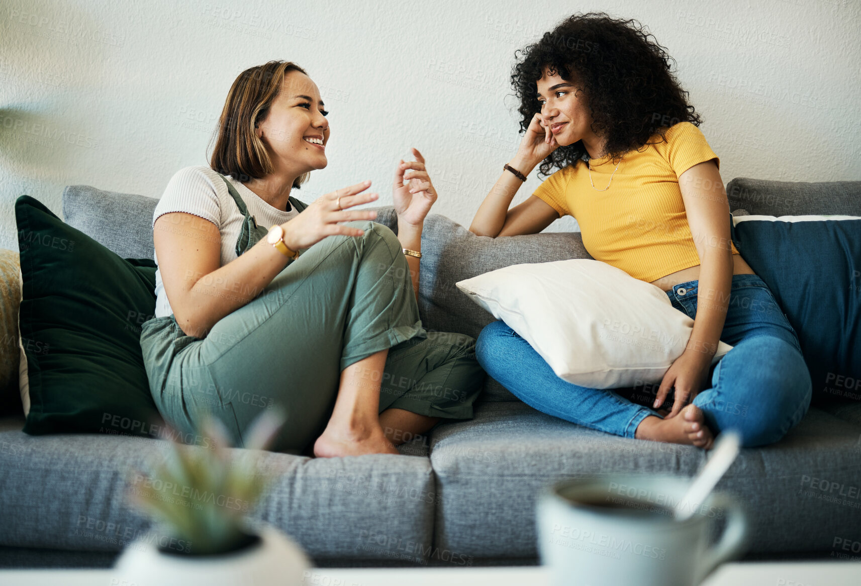 Buy stock photo Women, friends relax and conversation in a home with gossip, discussion and happy in a living room. Couch, smile and female person on sofa with communication together in a house lounge with speaking