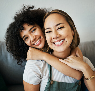 Buy stock photo Lesbian, couple and portrait of hug on sofa in home, living room or apartment with love, support and happiness. Lgbt, women or relax together on couch with pride, confidence smile in embrace in house