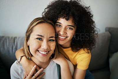 Buy stock photo Lesbian, couple and portrait of hug on sofa in home, living room or apartment with love, support and happiness. Lgbt, women and profile picture together on lounge couch with smile on face in house