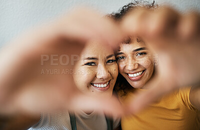 Buy stock photo Heart, hands and portrait of happy lesbian couple for care, trust and support in relationship at home. Love sign, face and gay women together in commitment to marriage, connection and LGBTQ or emoji