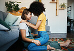 Lgbtq, couple and love with hug on a living room floor in new home with smile of lesbian women. Gay marriage, happy and together with care and support in a lounge with embrace sitting on the ground