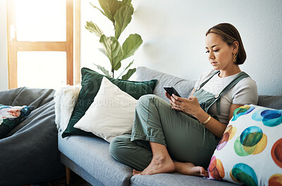 Buy stock photo Woman, relax on sofa with smartphone and chat online with communication, wellness and reading text message. Email, technology and mobile app with virtual conversation, typing on social media at home