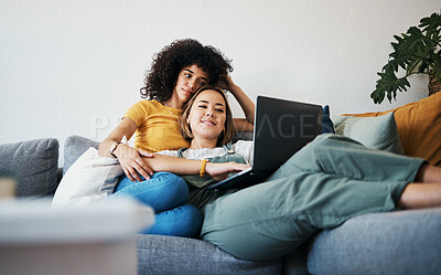 Buy stock photo Lgbtq, laptop and couple relax on sofa for watching movies, streaming series and online videos. Dating, lesbian and happy women on computer for internet, bonding and relationship in living room