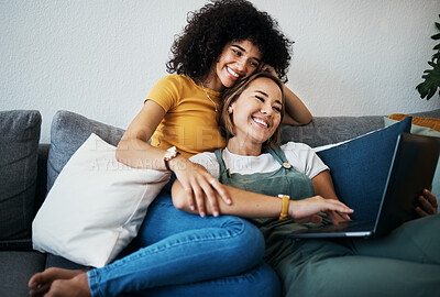 Buy stock photo Lgbtq, laptop and couple relax on sofa for watching movies, streaming series and online videos. Dating, lesbian and happy women on computer for internet, bonding and relationship in living room