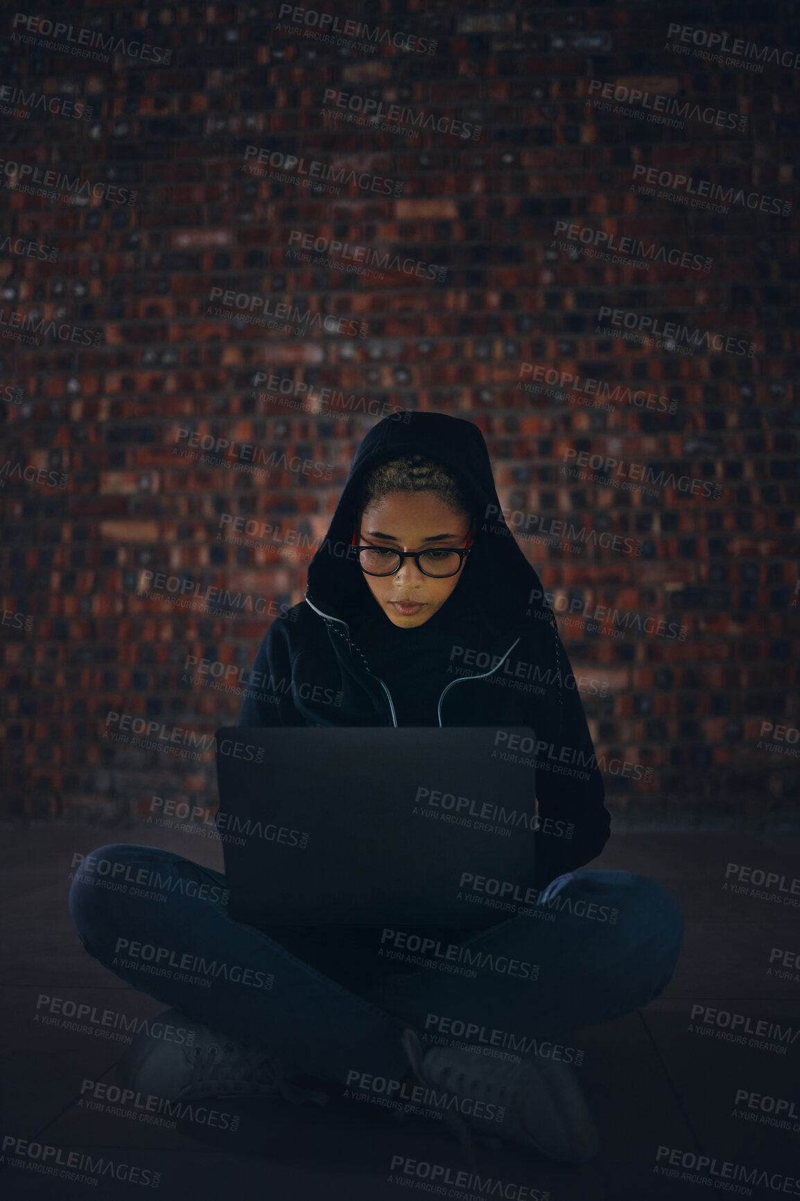 Buy stock photo Hacker, woman in basement and laptop, information technology for coding and database with phishing and cyber crime. Cybersecurity, programming or hacking, criminal with pc for ransomware and firewall