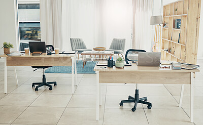 Buy stock photo Empty office, interior and coworking space with laptop on desk in startup company. Computer, table and creative workplace room with wood furniture, chair and modern design in workspace for business