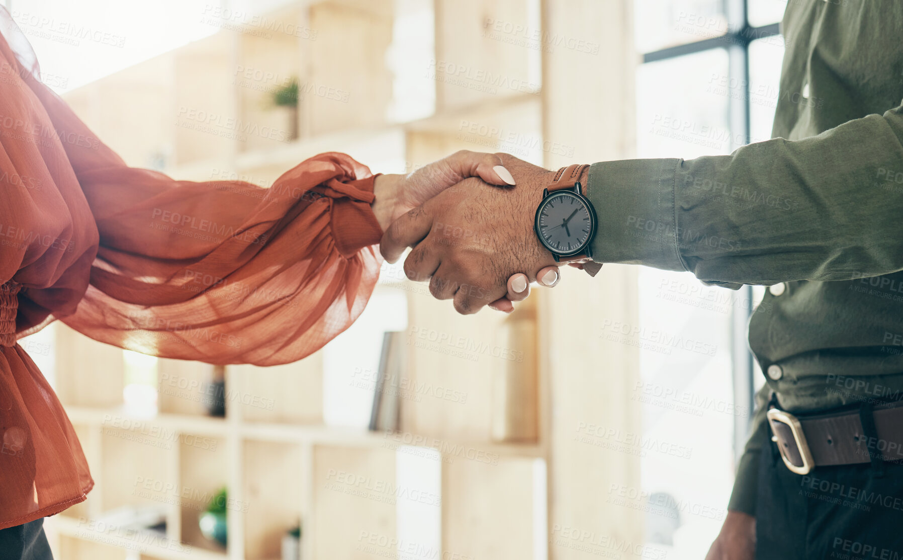 Buy stock photo Creative people, handshake and partnership in meeting, b2b deal or teamwork together at office. Closeup of man and woman shaking hands for startup, introduction or thank you in agreement at workplace