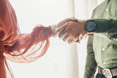 Buy stock photo Creative people, handshake and teamwork in meeting, b2b deal or partnership together at office. Closeup of man and woman shaking hands for startup, introduction or thank you in agreement at workplace