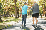 Senior friends, walk and talk in park in retirement, fitness and wellness in outdoors. Elderly people, talking and chatting in nature, workout and cardio for health, supportive in conversation