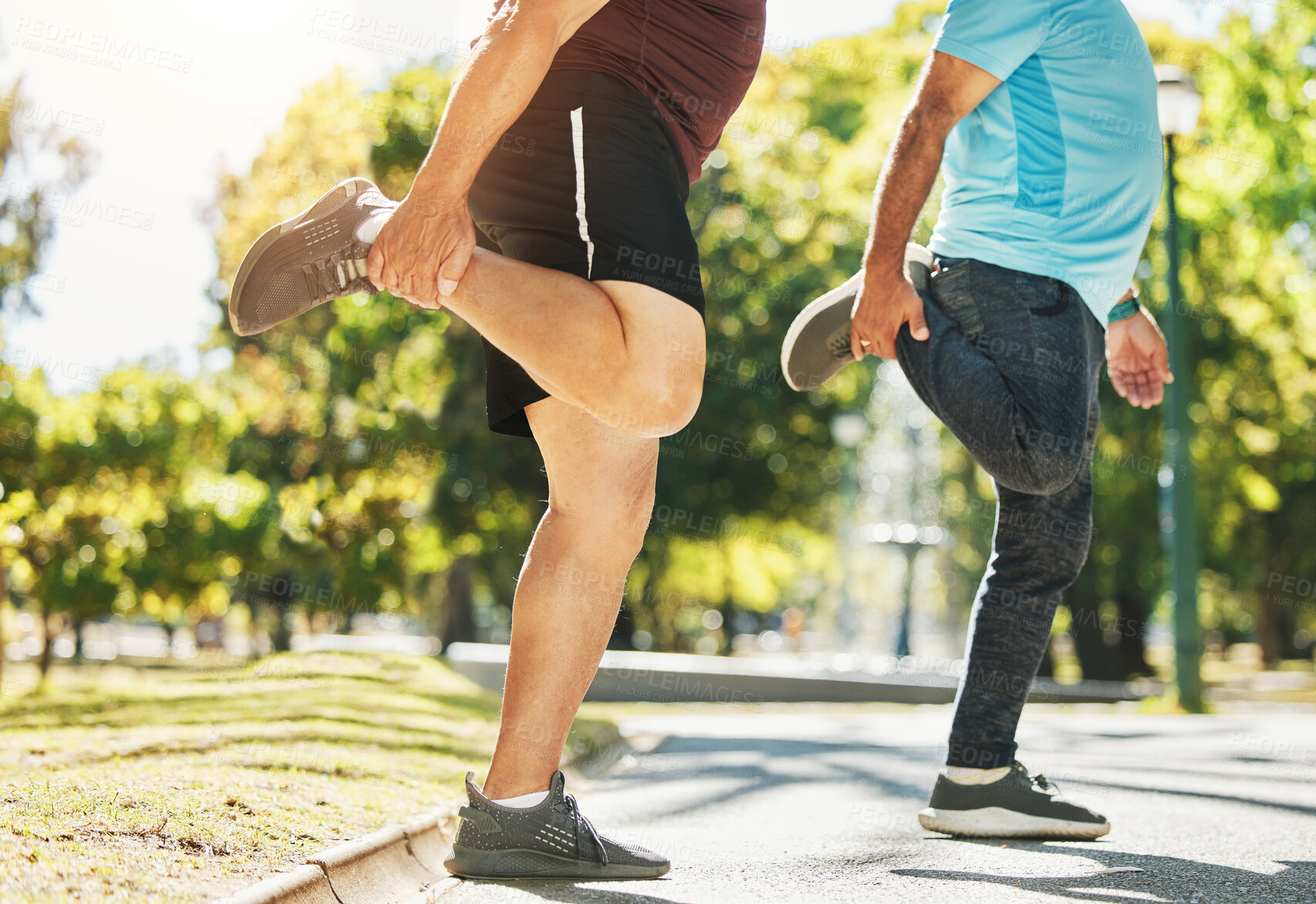 Buy stock photo People, friends and stretching legs in park for running, exercise or outdoor training together in nature. Men in body warm up, leg stretch or preparation for cardio workout or team fitness outside