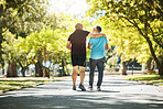 Park, walking and back of senior men for wellness, healthy body and wellbeing in retirement, Friends, happy and mature people with smile, hug and embrace outdoors for exercise, workout and sports