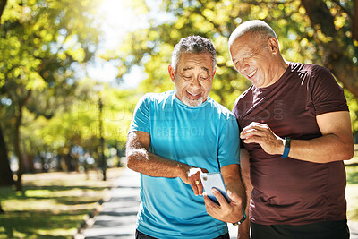 Buy stock photo Social media, men and a phone in a park for fitness, training results and conversation about an app. Happy, communication and senior friends with a mobile to monitor health after exercise or running