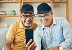 Video call, phone and senior men on sofa smile for chat, conversation and video call at home. Retirement, hello and mature people on smartphone for internet, discussion and bonding in living room